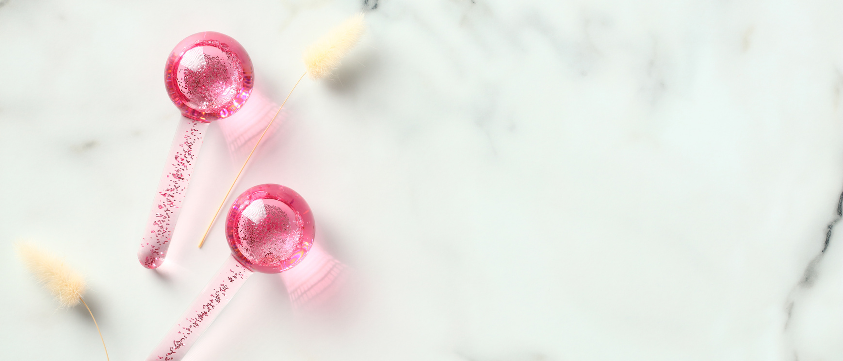 Ice Globes Massage Tool for Face on Marble Table